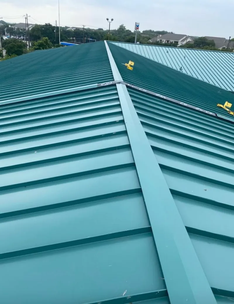 Green commercial metal roof ridge and valley for Metal Roof Repair in Nacogdoches
